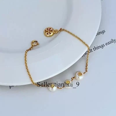 New Tory Gold Plated 3 Pearl Logo Bracelet Gold OS with Jewelry Pouch Size: 19cm - Image 1 of 4