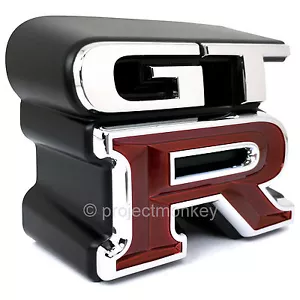 JDM Nissan 62896-AA400 99-02 Skyline GT-R R34 Front "GT-R" Emblem Genuine OEM - Picture 1 of 2