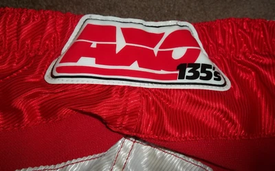 VINTAGE AXO RACING 135'S RED NYLON MOTOCROSS PANTS SIZE MENS 32" SPORT CLOTHING - Image 1 of 4