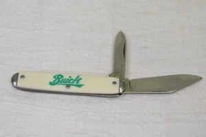 Coltello tascabile vintage Buick 2 lame accessorio distintivo bianco ovale uomo grotta - Foto 1 di 5
