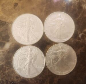 Lot of 4 Silver American Eagle 1 oz. Fine .999 US oz Coins 1992 2002 2019 2021