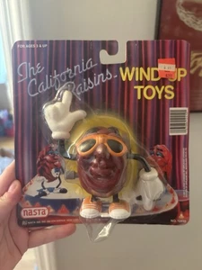 Juguete de cuerda California Raisin 1987 nuevo en paquete - Imagen 1 de 1