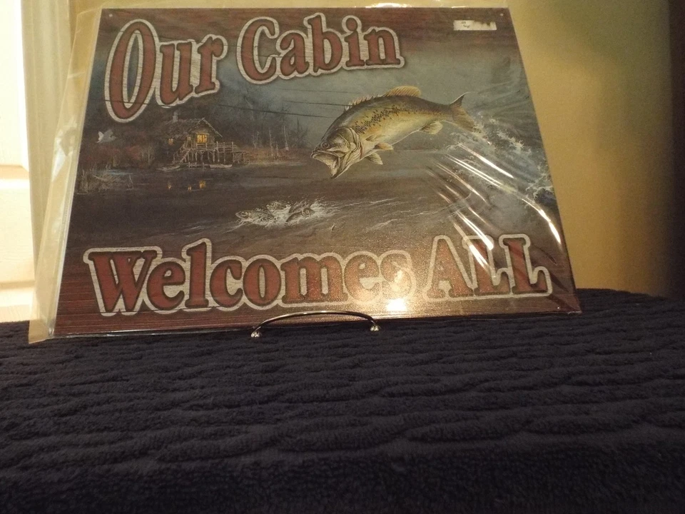 Desperate Enterprises Our Cabin Welcomes All Tin Sign 16" W .5" H