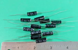 12 PCS DELCON AE3R3M10022X50V85 AXIAL CAPACITORS 3.3uF 100V - Picture 1 of 2