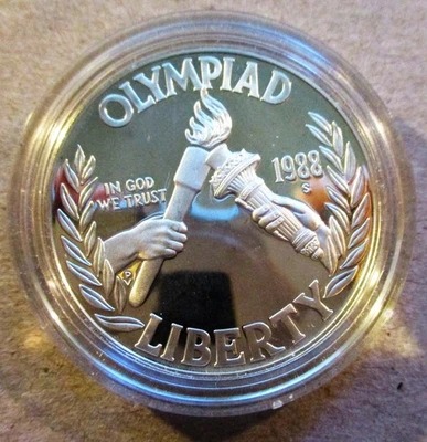 1988-S SEOUL OLYMPIAD MODERN COMMEMORATIVE SILVER DOLLAR. IN CAPSULE. NO CASE. - Image 1 of 2