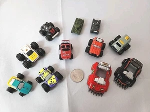 VTG Micro Machines 7 Funrise Monster Trucks, 2 Highway Warriors, 2 Tanks - Picture 1 of 7