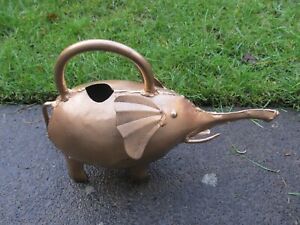 A SMALL GOLD COLOURED, METAL ELEPHANT SHAPE, WATERING CAN, GARDEN AND BALCONIES.
