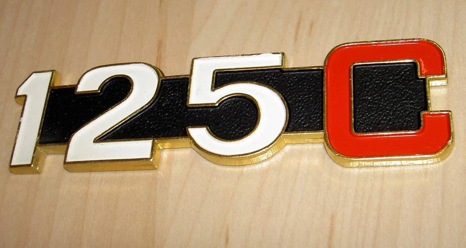 1970's Moto Guzzi 125cc Custom NOS side cover badge, gold metal 4" long - Изображение 1 из 1