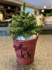 9.5" Faux Christmas Tree In a 5" Burgundy Pot That Says JOY w/Buffalo Check Bow - Picture 1 of 3