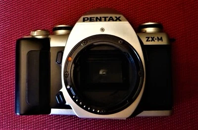 Pentax  ZX-M  body for parts or repairs. AS IS. - Image 1 of 3
