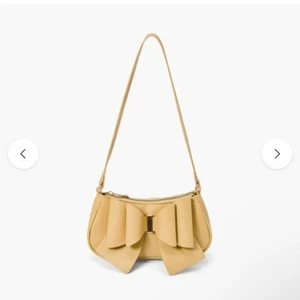 CROSSI MUSTARD COLOR VEGAN BOW BAGUETTE MINI HANDBAG - Picture 1 of 5