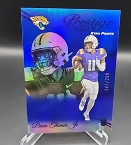 2024 Panini Prestige #321 Brian Thomas Jr. Blu Xtra Points /299 Jaguars - Foto 1 di 3