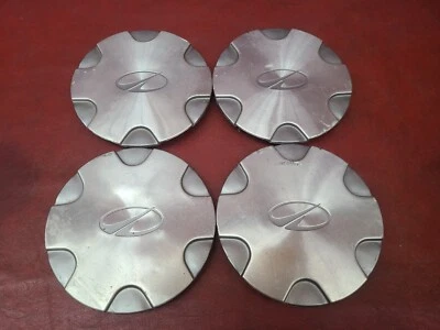 Juego (4) Tapas centrales mecanizadas Oldsmobile Bravada 15" OEM 1998-2001 15037838 6032 Foto 1 de 4