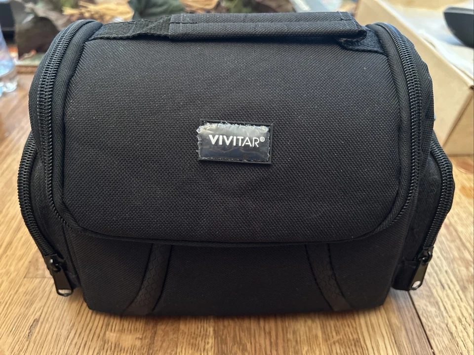 Bolsa pequeña para cámara vivitar negra, soplador limpiador de polvo y Foto 1 de 4