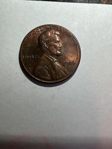 1986 lincoln penny no mint mark, Off Center, VDB/FG Clearly Seen, Red Toned Cover
