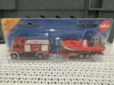 Siku Super Serie 1636 Unimog Fire Engine with Boat 1:87 Diecast Toy Truck - Image 1 of 2