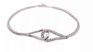 Bracciale infinito ad incastro oro bianco 14 kt fantasia diamante curvo 0,20 carati - Foto 1 di 6