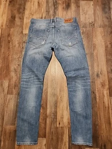 Pantalones de mezclilla para hombre Diesel TEPPHAR-X desgastados 0098U elásticos ajustados azules W34 L32 - Imagen 1 de 22
