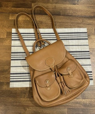 Vintage Dooney & Bourke Tan Leather Backpack It’s Drawstring Closure USA Made - Image 1 of 4