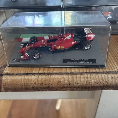 Panini 1/43 Sebastian Vettel Ferrari SF15-T 2015 Malaysia GP - Image 1 of 3