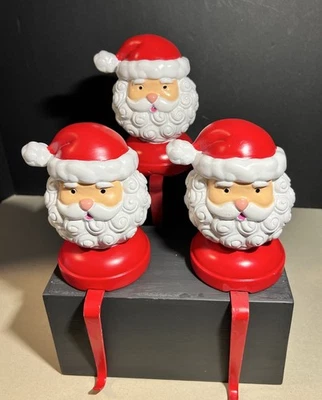 Vintage Santa stocking holders nostalgic Christmas decor - Image 1 of 4