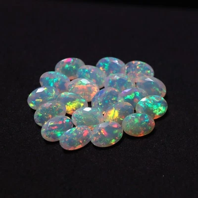 5x7 MM Oval Cut Natural AAAA Flashy Rainbow Fire Faceted Ethiopian Opal 25 Pcs - Image 1 of 4