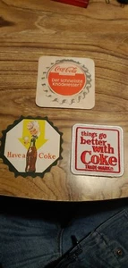 KONVOLUT 3 VINTAGE HABEN EINE KOKS PAPIER UNTERSETZER EIN PATCH UND EIN DEUTSCHER UNTERSETZER  - Bild 1 von 12