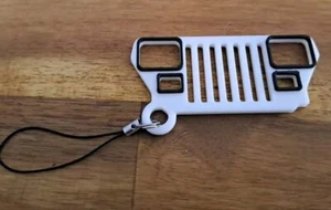 Llavero parrilla/logotipo impreso en 3D con detalles negros Jeep Wrangler (YJ) - Imagen 1 de 1