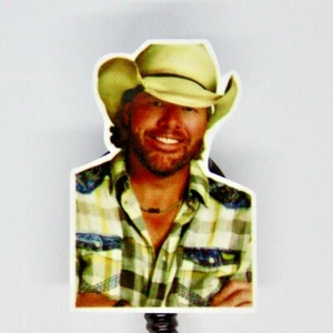 Carrete de insignia Toby Keith soporte de identificación orgulloso cantante estadounidense de música country - Imagen 1 de 2