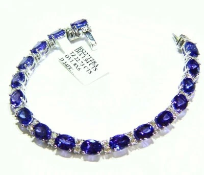 Brazalete retro de compromiso con halo de diamantes de tanzanita natural de oro de 24,67 quilates 14 quilates Foto 1 de 4