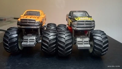 Earth Shocker Ram 1500 Orange /MARVEL SPIDERMAN BLACK Monster Truck LOT OF 2 NM  - Image 1 of 4