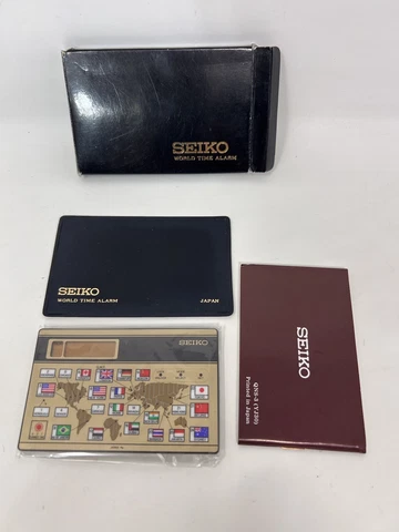 VTG Seiko Quartz 18 Time Zone Travel World Map Time Alarm Clock Calendar QNS911G Cover