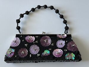 Black sequin evening bag with purple sequin flowers.  Black beaded handle.  