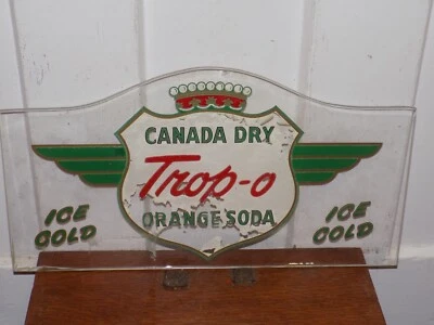 Letrero pintado al revés vintage de vidrio de soda naranja Trop-O de Canadá seco Foto 1 de 4