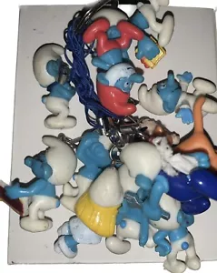 12 Smurfs On A Keyring Papa Brainy Gargamel Smurfette Azrael Baby Jokey Handy - Picture 1 of 15