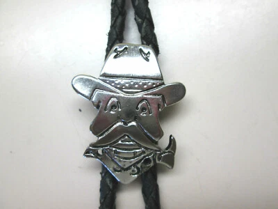 Corbata Bolo Cabeza de Vaqueros Corona Dorada, Slide Acero Tono Plateado Corbata Cuero Negro Foto 1 de 4