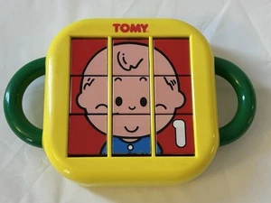 TOMY Yellow Plastic Matching Puzzle Flip Toy - 1992 - Picture 1 of 8