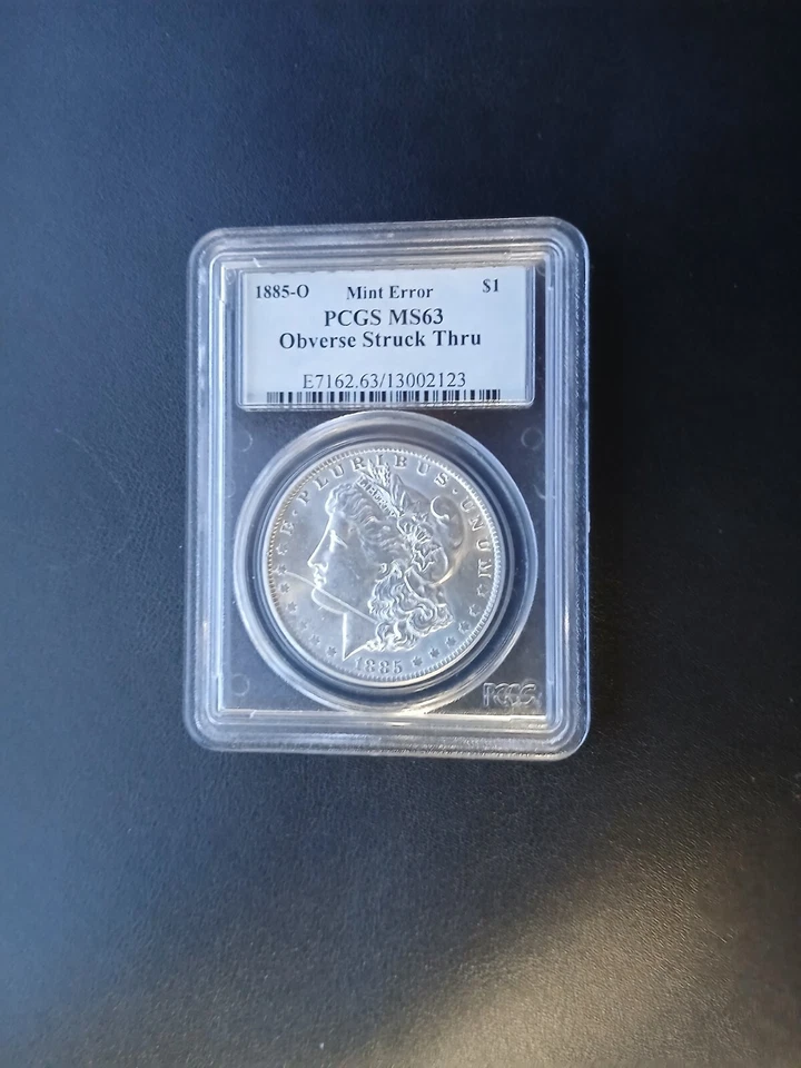 1885-O Morgan Silver Dollar OBVERSE STRUCK THRU PCGS MS 63 Pictures included - Image 1 of 4
