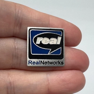 Vintage RealNetworks Enamel Lapel Pin Blue Black Logo - Image 1 of 4