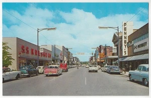 1950 Adrian, Michigan - Main Street, coches antiguos, escaparates - postal vintage - Imagen 1 de 2