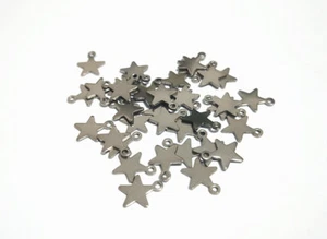 20pz ciondoli mini stella  in acciaio inox 10x8mm colore argento scuro bijoux - Foto 1 di 1