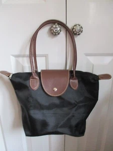 Black fabric, tan faux leather trim/handles, plastic lined, bucket/hand bag - Picture 1 of 6