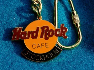 STOCKHOLM SWEDEN FC PARRY DEEP ORANGE LOGO KEYCHAIN Hard Rock Cafe not a pin - Picture 1 of 1