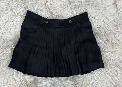 Falda negra con botones plisados Bebe Foto 1 de 3