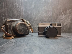 Cámara Canon Canonet con estuche + lente de 45 mm no probada solo para piezas o reparación  - Imagen 1 de 12