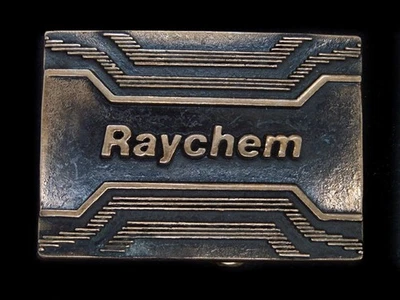 UB15123 VINTAGE 1978 **RAYCHEM** ADVERTISEMENT SOLID BRASS BTS BELT BUCKLE - Image 1 of 2