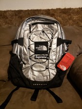 supreme north face backpack silver