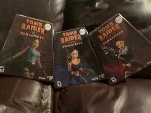 Tomb Raider I-III Remastered LRG PS5 All 3 Event Exclusive Box New Sealed - Picture 1 of 16