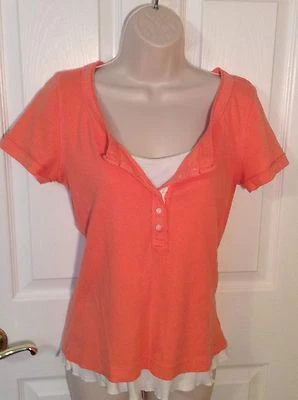 Top tejido LizWear, naranja con bajo cami blanco. Talla Med. Excelente estado. Foto 1 de 4
