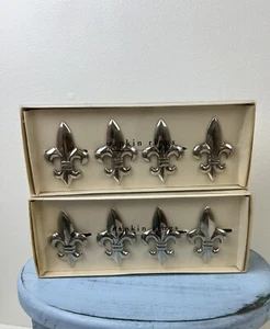 Fleur De Lis 8 servilleteros Pier One 2 juegos plateados niquelados NUEVO - Imagen 1 de 4